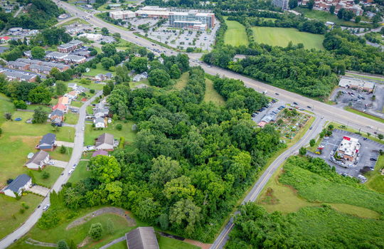 commercial property for sale, 5.62+/- acres, stone drive kingsport tn, neighboring homes, neighboring businesses, mountain views, aerial photo