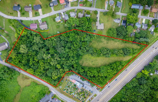 Commercial Land, 5.62+/- Acres, Property Outline, neighboring properties, Road, Trees