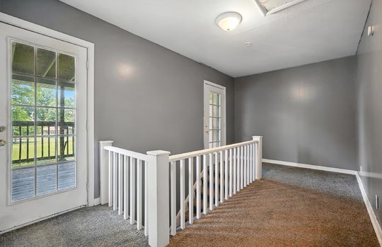 upstairs apartment, carpet, stairs, landing, doors to deck