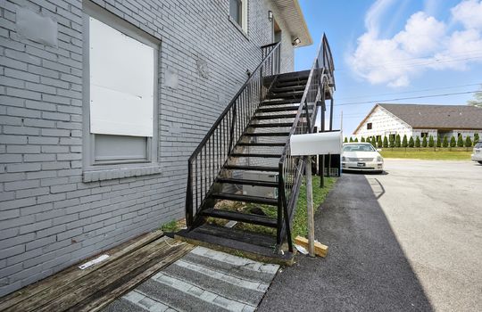 stairs to upstairs apartment, brick exterior