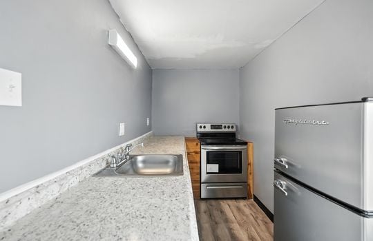 kitchen, oven/range, refrigerator, sink, luxury vinyl flooring