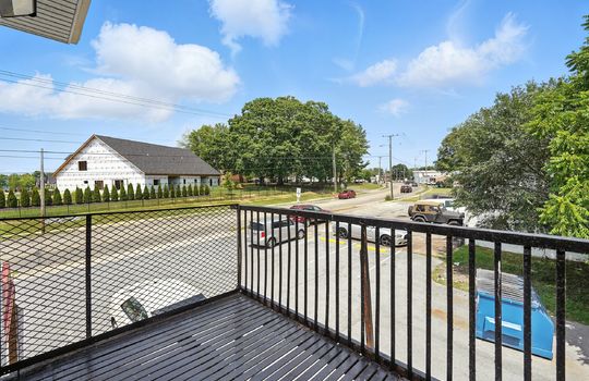 view from apartment porch, road, railing