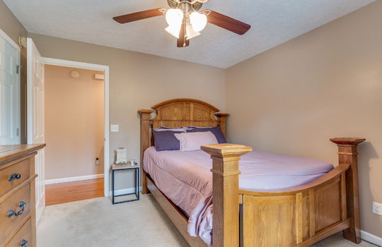bedroom, carpet, ceiling fan, door to hallway, closet