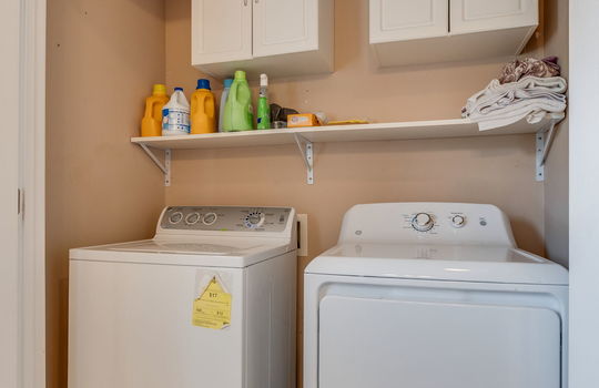 bathroom laundry area, washer/dryer hookups, shelving, cabinets