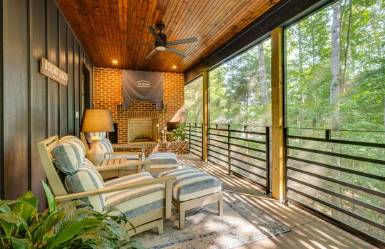 screened in porch, wood ceiling, wood siding, brick fireplace, wooded views, ceiling fan