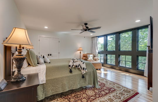 bedroom, closet, windows, ceiling fan, hardwood flooring