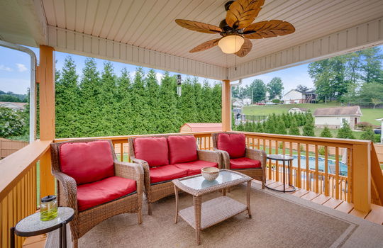 covered back deck, outdoor ceiling fan, back yard, pool