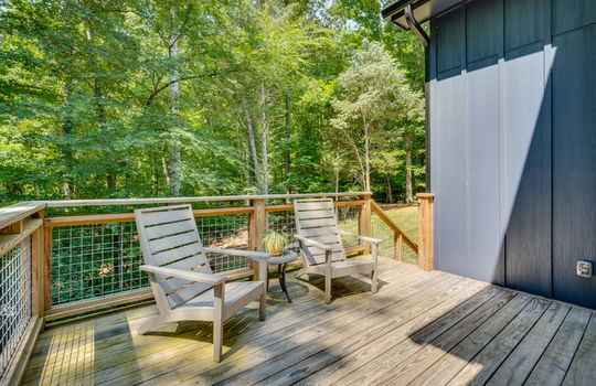 main home, back deck, wood siding, back yard, trees