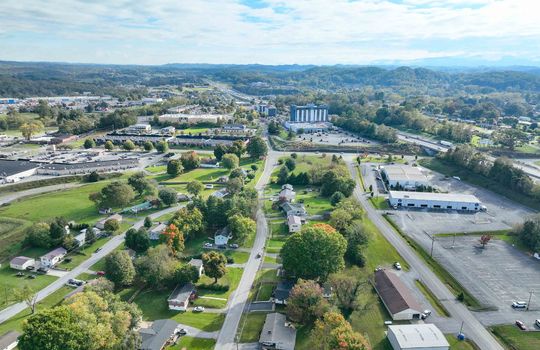 aerial view of property, road, neighboring homes, neighboring businesses, mountains, Hard Rock Casino