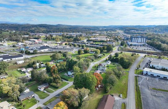 aerial view of property, road, neighboring homes, neighboring businesses, mountains, Hard Rock Casino