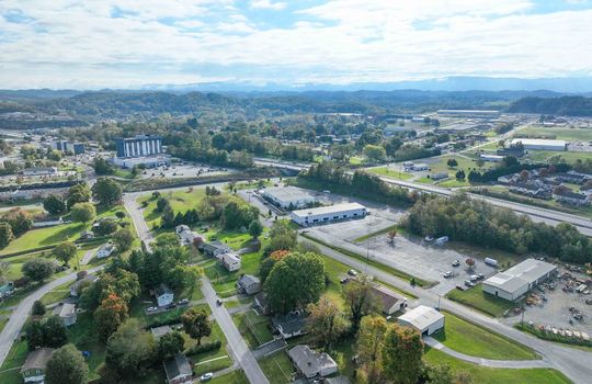 aerial view of property, road, neighboring homes, neighboring businesses, mountains, Hard Rock Casino