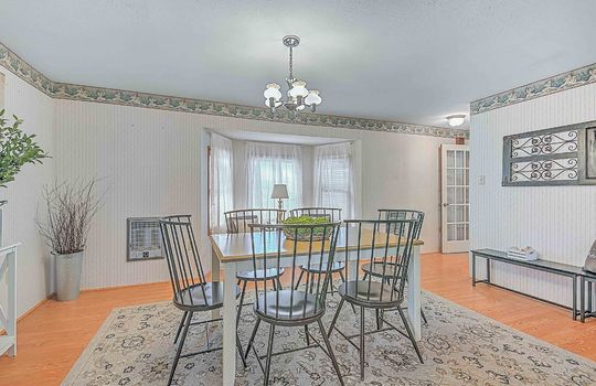 dining room, chandelier, bay window, hardwood flooring