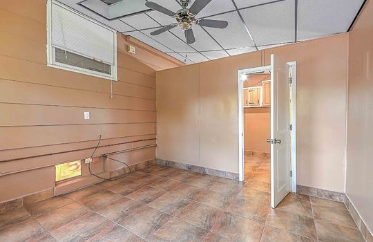 room, tile flooring, ceiling fan, window