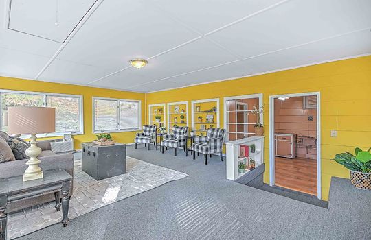 Sunroom, indoor/outdoor carpet, windows, built in shelving