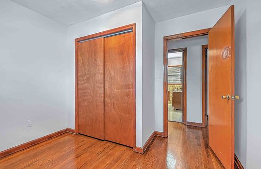 bedroom, closet, hardwood flooring, door to hallway