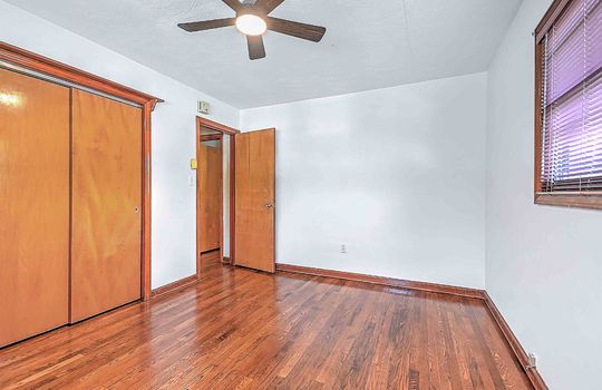 bedroom, closet, hardwood flooring, windows, ceiling fans