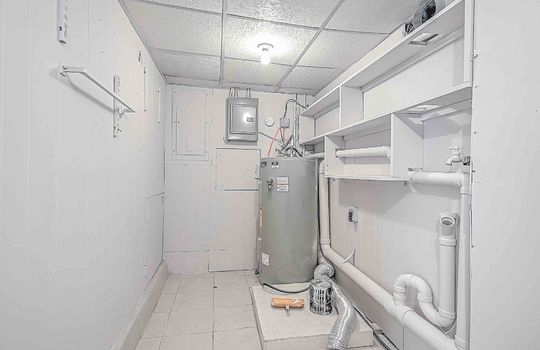 Laundry room/utility room, tile flooring, shelving