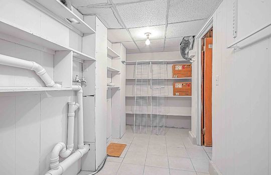 Utility room, shelving, tile flooring