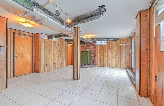 lower level walk-out basement, tile flooring, paneling walls