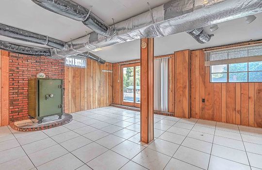 lower level walk-out basement, tile flooring, paneling walls