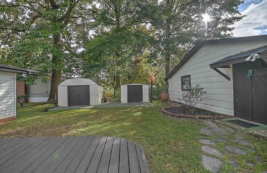 back yard, storage sheds, workshop, landscaping, fencing