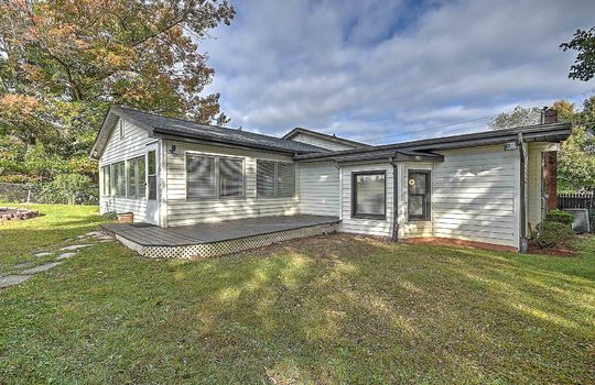 back of home, vinyl siding, sunroom interior door, back yard