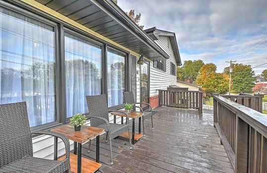 front porch, front door, windows, wood porch, wood steps, vinyl siding