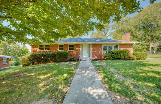front of home, front yard, sidewalk, front door, brick ranch, for lease, windows, trees, landscaping