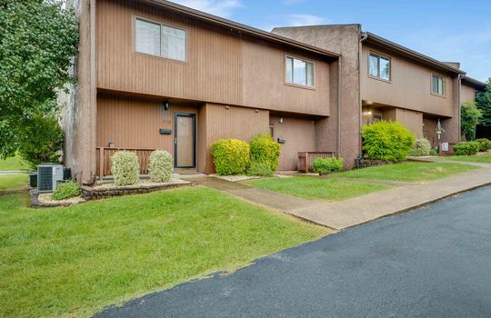 townhouses, front porch, storm door, front door, wood siding, concrete exterior, window,