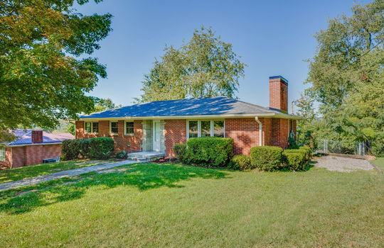 front of home, front yard, sidewalk, front door, brick ranch, for lease, windows, trees, landscaping