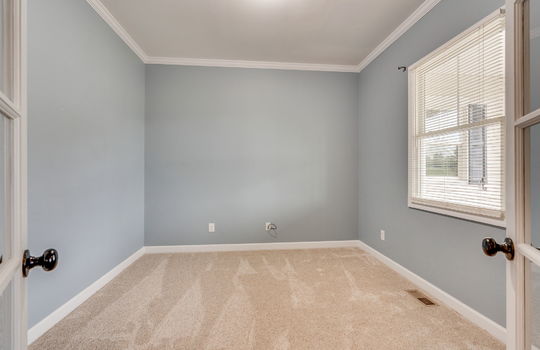 bedroom/office, carpet, french doors, window