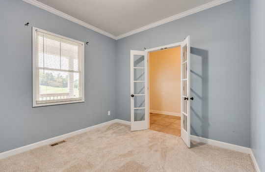 bedroom/office space, french doors, carpet, window