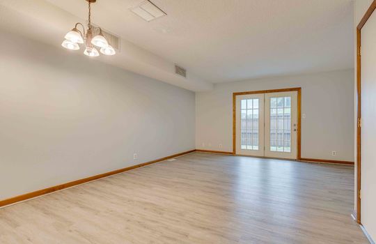 living room, vinyl flooring, door to patio