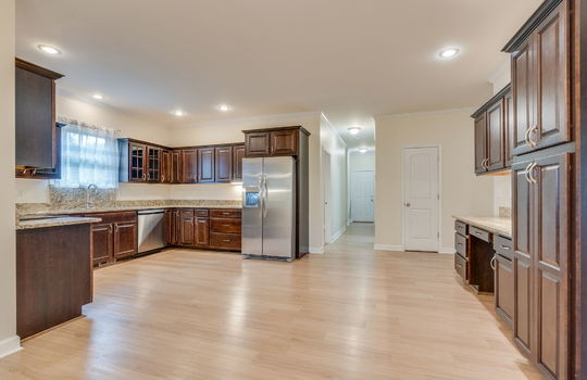 kitchen, hardwood flooring, cabinets, granite countertops, stainless appliances, refrigerator, dishwasher, oven/range, sink, window above sink