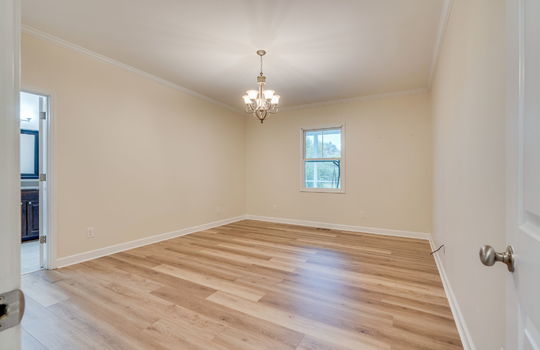 bedroom, hardwood flooring, primary bedroom, ensuite bathroom, window