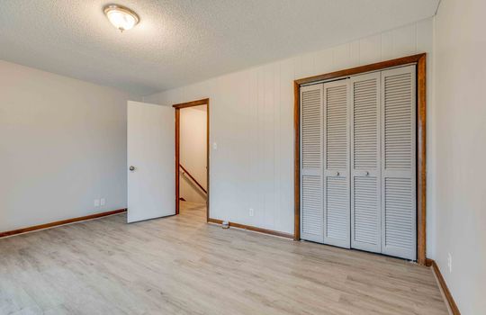 bedroom, closet, vinyl flooring