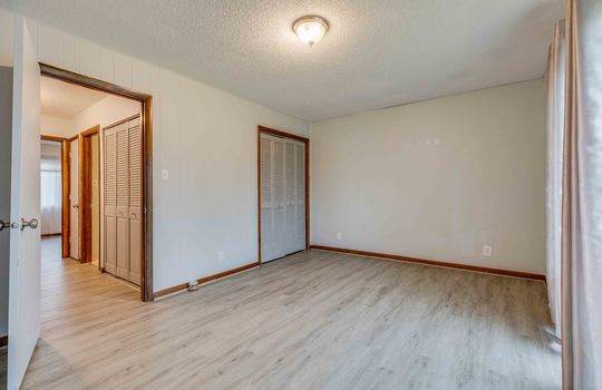 bedroom, closet, door to private balcony, door to hallway