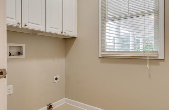 laundry room, cabinets, washer/dryer hookups, window