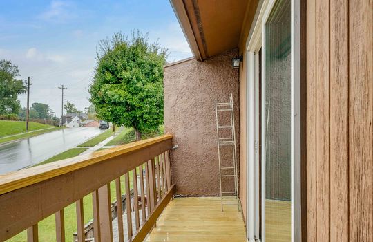 upper level private balcony, wood siding, concrete partition