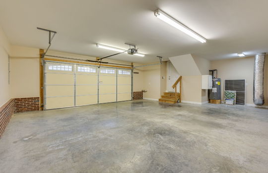 garage, concrete flooring, garage doors, interior door