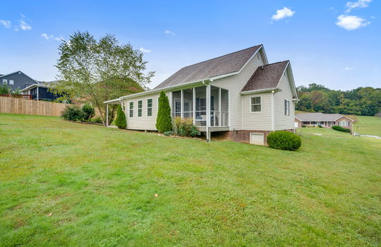 back of home, back yard, side yard, screened porch, landscaping
