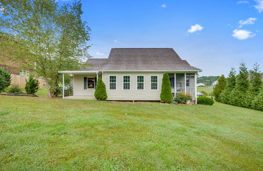 back of home, screened porch, back patio, back yard, landscaping, vinyl siding