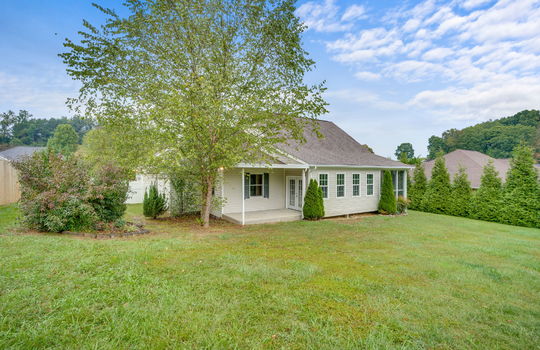 back of home, screened porch, sunroom, back patio, landscaping, exterior doors
