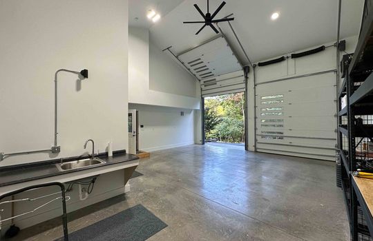 guest home garage, garage doors, concrete flooring