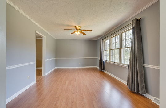 living room, laminate flooring, ceiling fan, windows