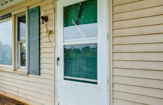 covered front porch, front door, vinyl siding, fixer upper