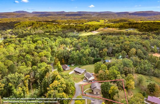 aerial photo of home, property outline, neighboring homes, trees, mountains