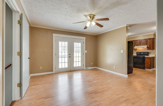 dining area, ceiling fan, laminate flooring, kitchen, doorway to lower level