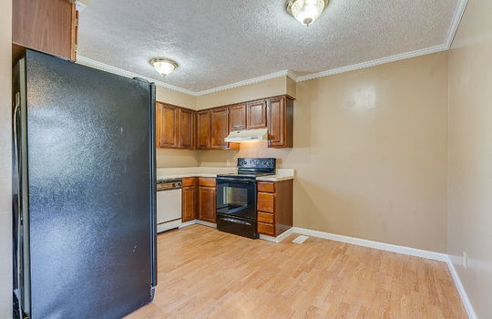 kitchen, laminate flooring, dishwasher, refrigerator, oven/range, cabinets, countertops