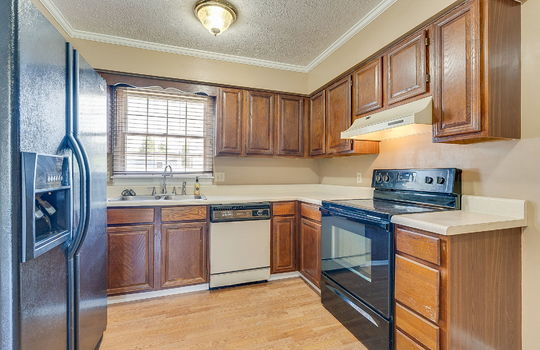 kitchen, refrigerator, dishwasher, oven/range, cabinets, countertops, sink, window above sink